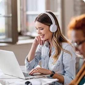 Woman working with headphones in modern office